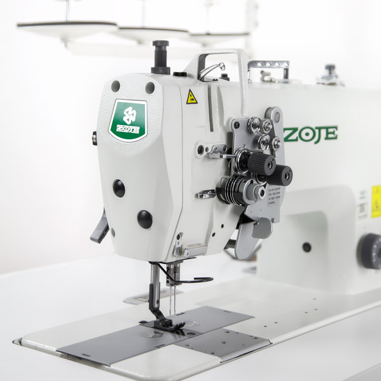 Two needle lockstitch sewing machine for medium and heavy materials with split needle bars, large hooks, in-build AC Servo motor - complete set